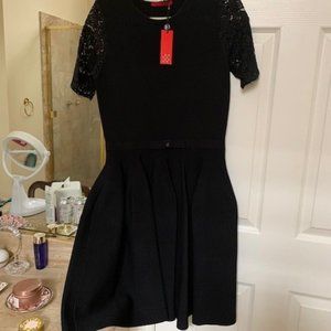 Carolina Herrera LBD with lace sleeves and CH belt